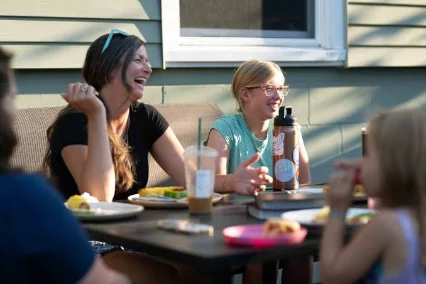 Friends sharing a meal at a table